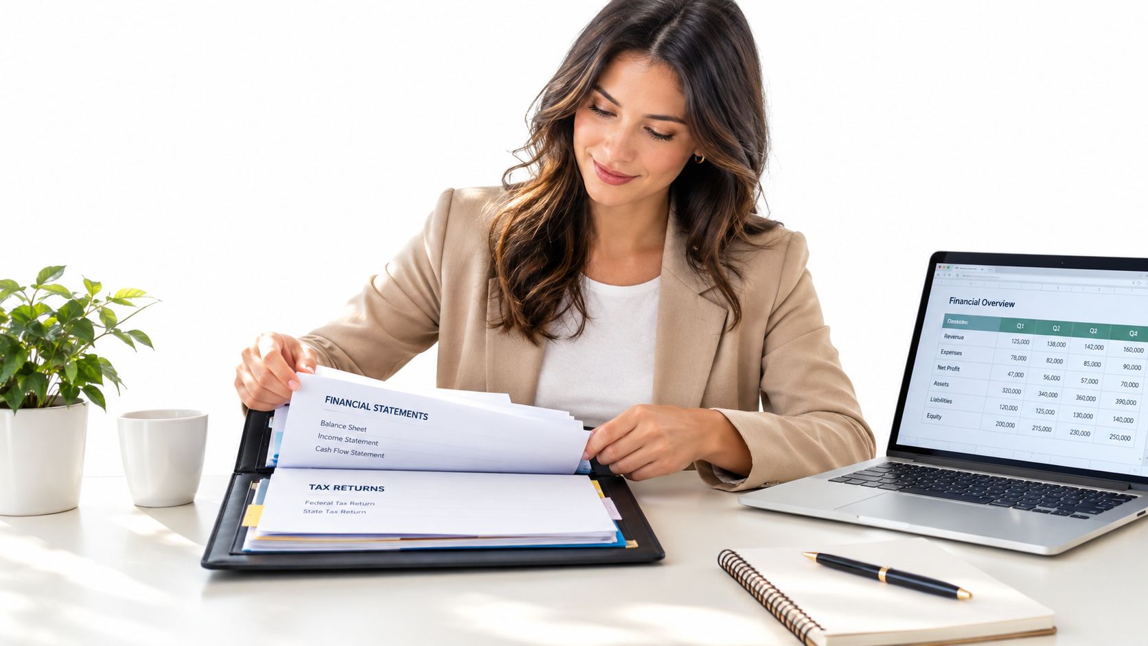 A professional woman in a blazer reviewing financial statements and tax return documents at her office desk.